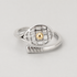 14K Gold Tennis Ball Ring with silver racquet detail and gold ball on grey