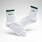 White womens tennis socks with green trim, breathable cotton blend socks for tennis and everyday wear.