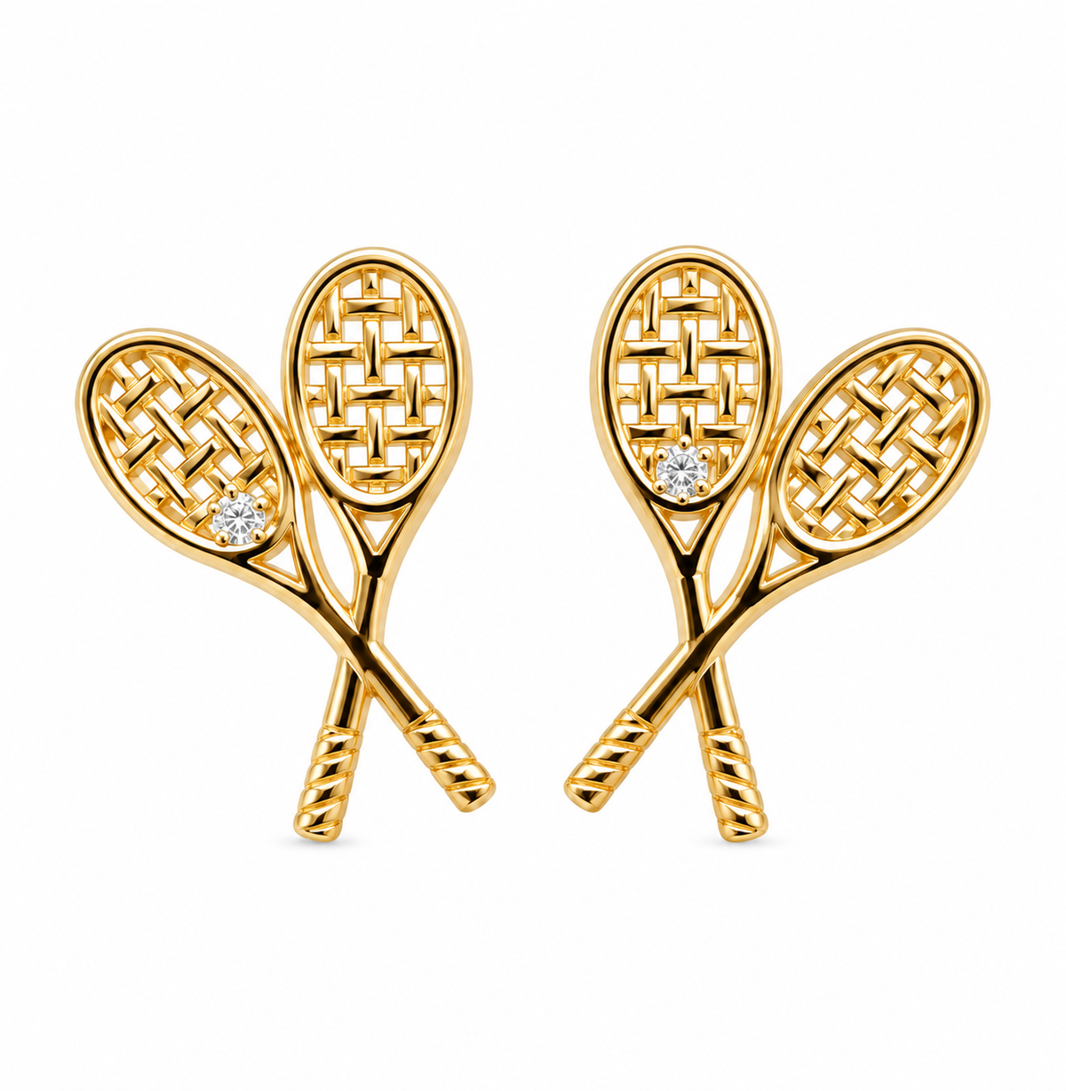 Pair of gold-tone crossed tennis racquet stud earrings with clear stone details on a white background
