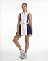 Studio shot of a women’s tennis dress with pleated skirt, showcasing a clean, modern design and athletic fit.