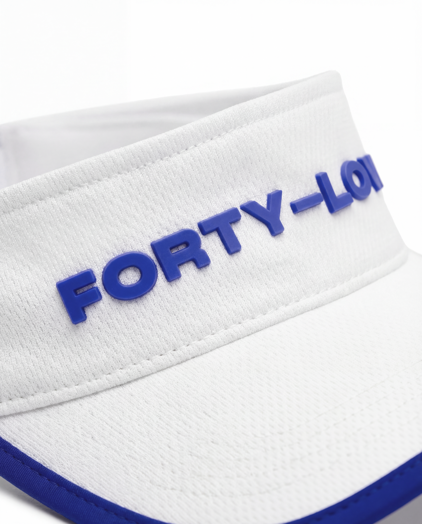 Close-up of embroidered Forty-Love logo on white tennis visor, premium finish womens tennis visor.
