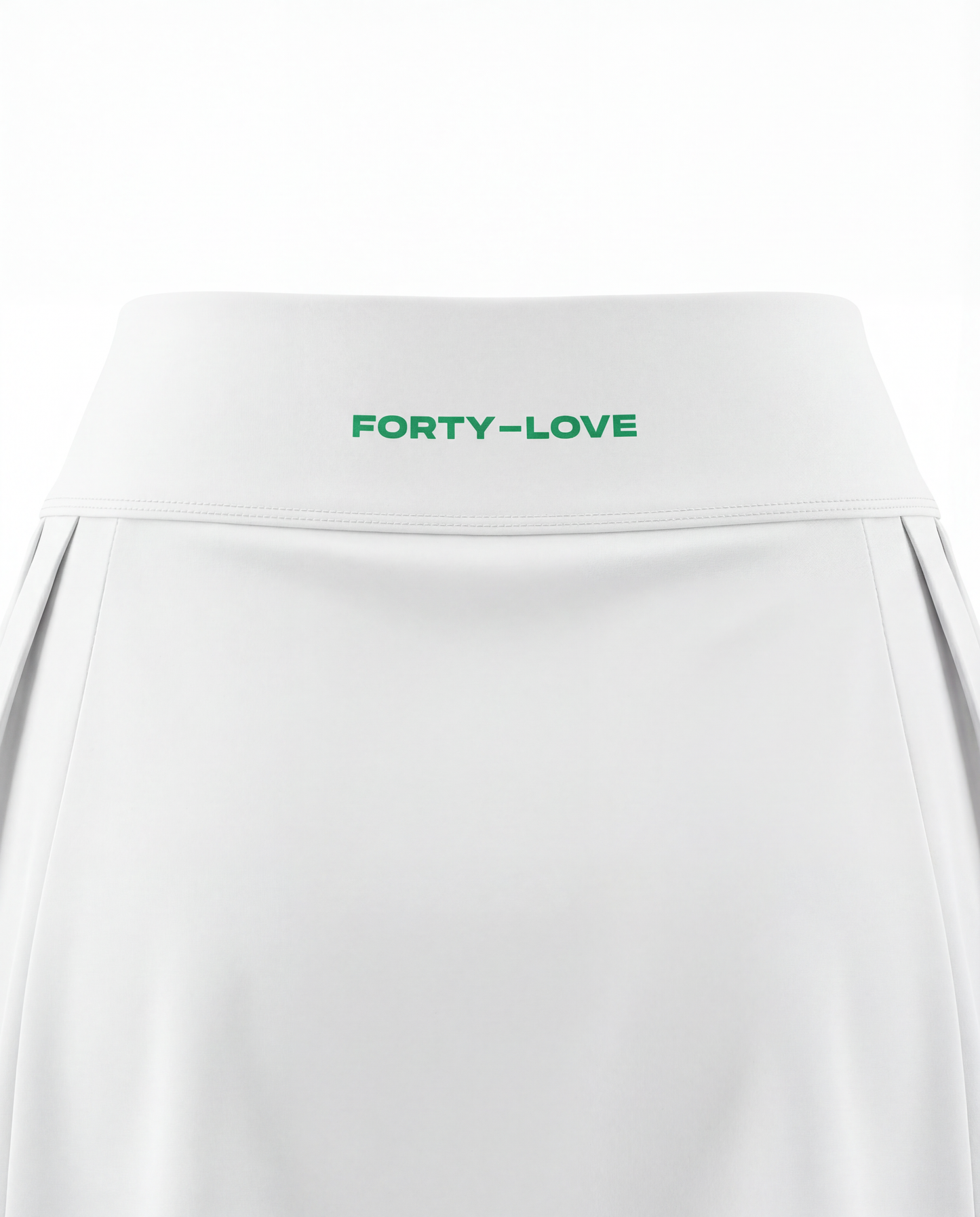Close-up of waistband branding on a white women’s tennis skort, featuring Forty-Love logo detail.